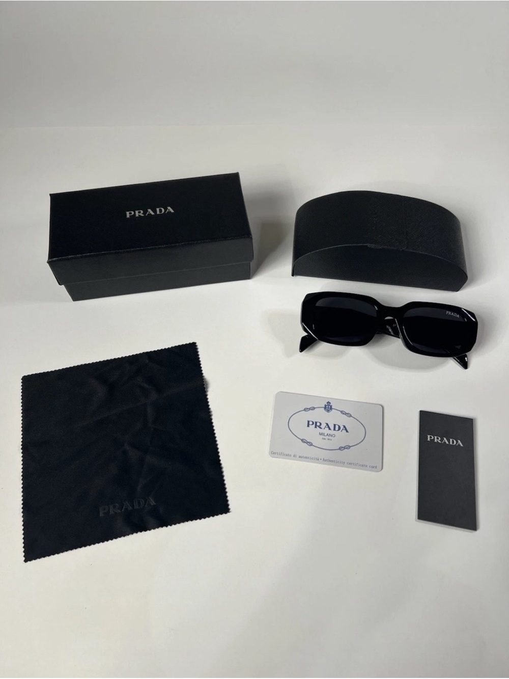 Prada Sunglasses — Unisex
